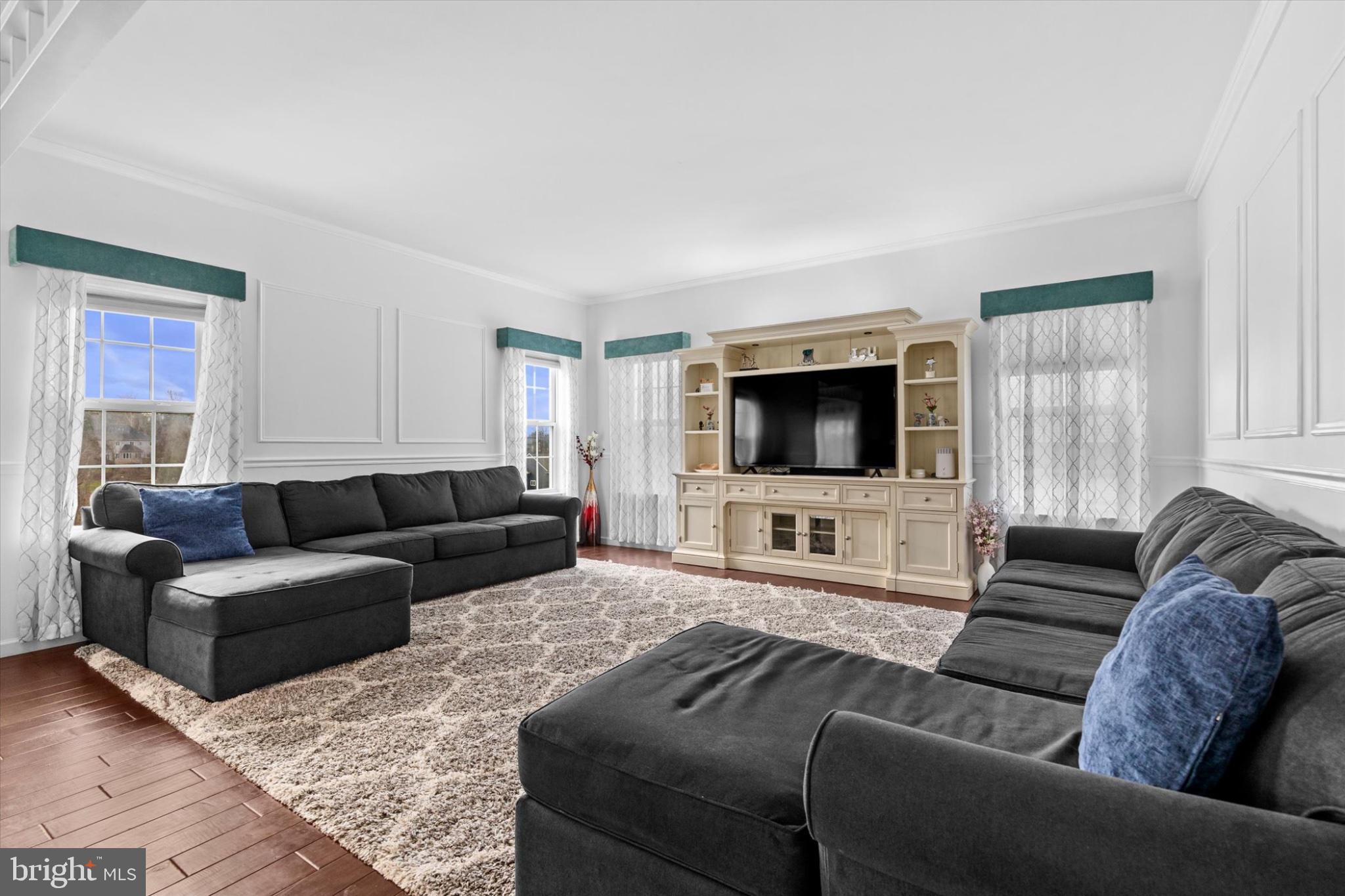 3 Rycroft Road Mechanicsburg, PA 17050 - Photo 8 of 55 a living room with furniture and a flat screen tv
