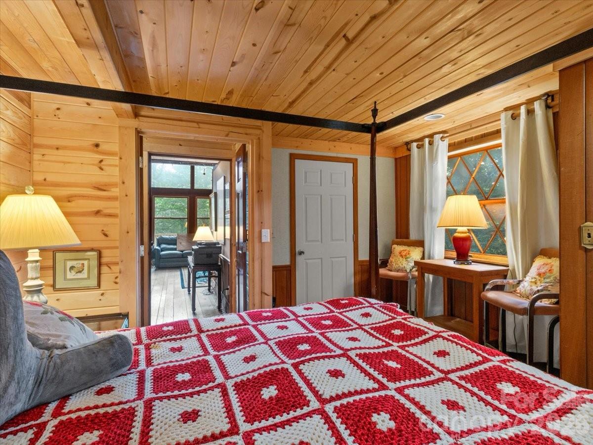 119 Foxden Road Mars Hill, NC 28754 - Photo 32 of 38 a bedroom with a bed and wooden floor