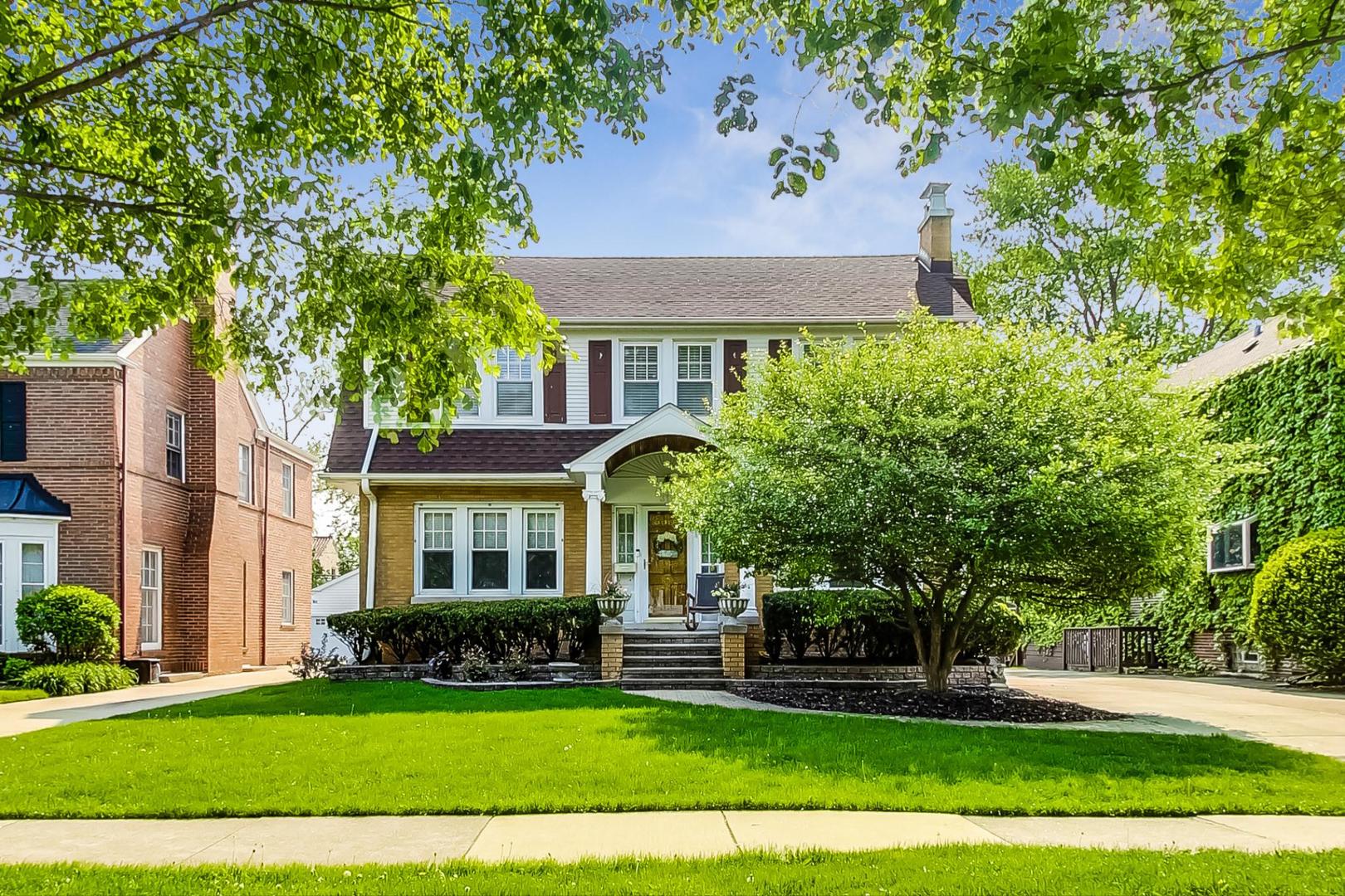 315 Elmore Street Park Ridge, IL 60068 - Photo 2 of 39 a front view of a house with a yard