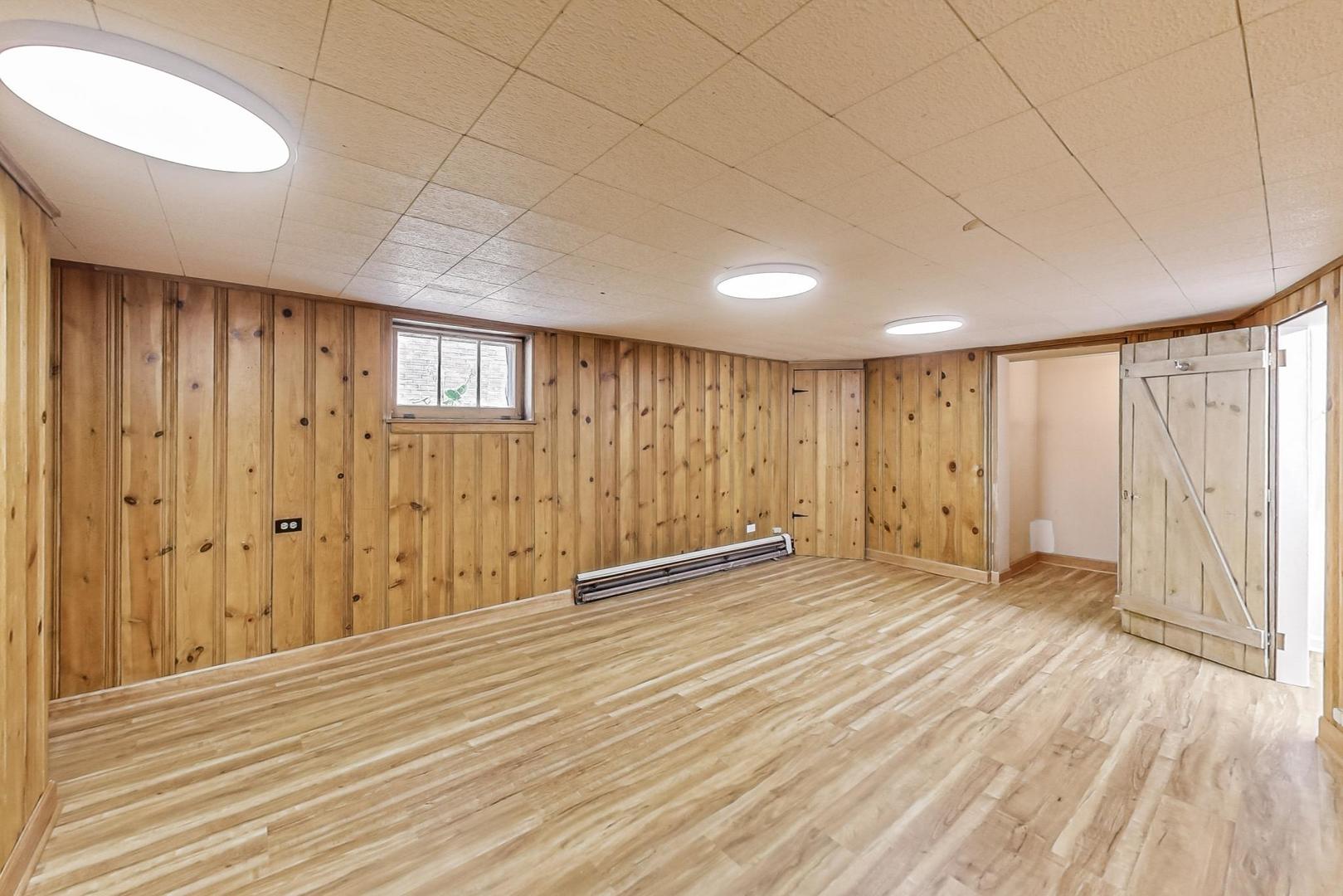 315 Elmore Street Park Ridge, IL 60068 - Photo 25 of 39 a view of an empty room with wooden floor