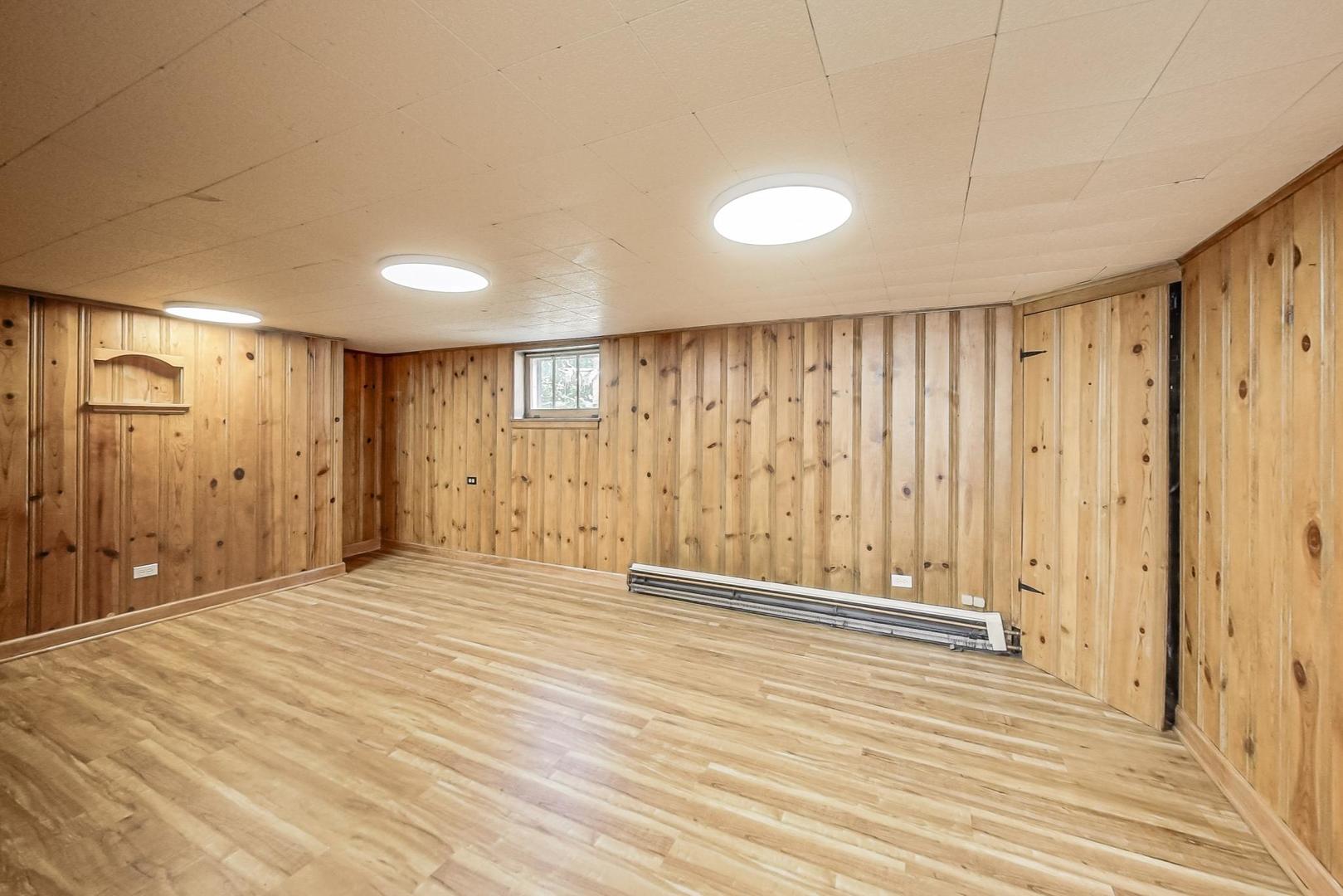 315 Elmore Street Park Ridge, IL 60068 - Photo 27 of 39 a view of an empty room with wooden floor