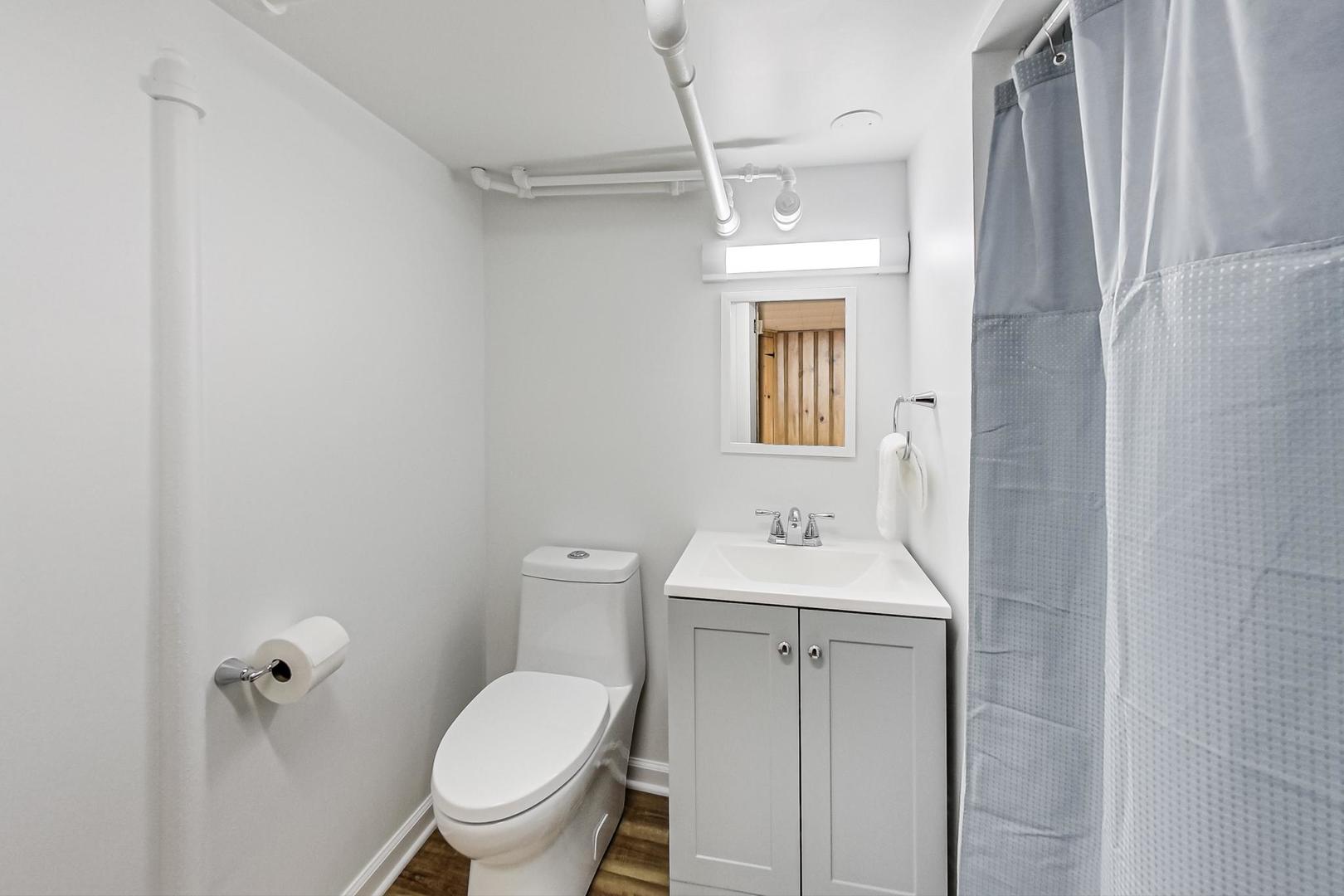 315 Elmore Street Park Ridge, IL 60068 - Photo 28 of 39 a bathroom with a toilet sink and mirror