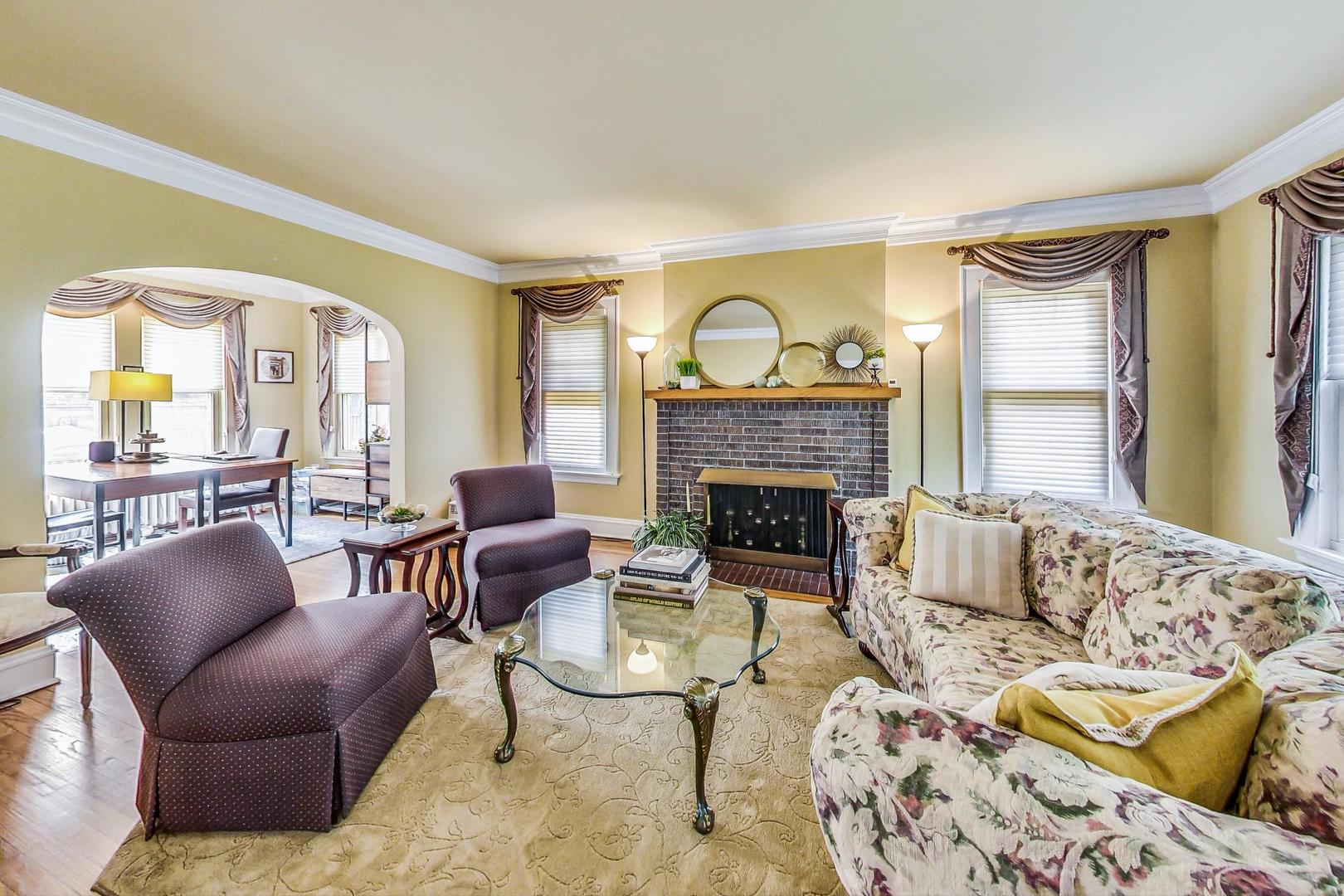 315 Elmore Street Park Ridge, IL 60068 - Photo 6 of 39 a living room with furniture and a fireplace