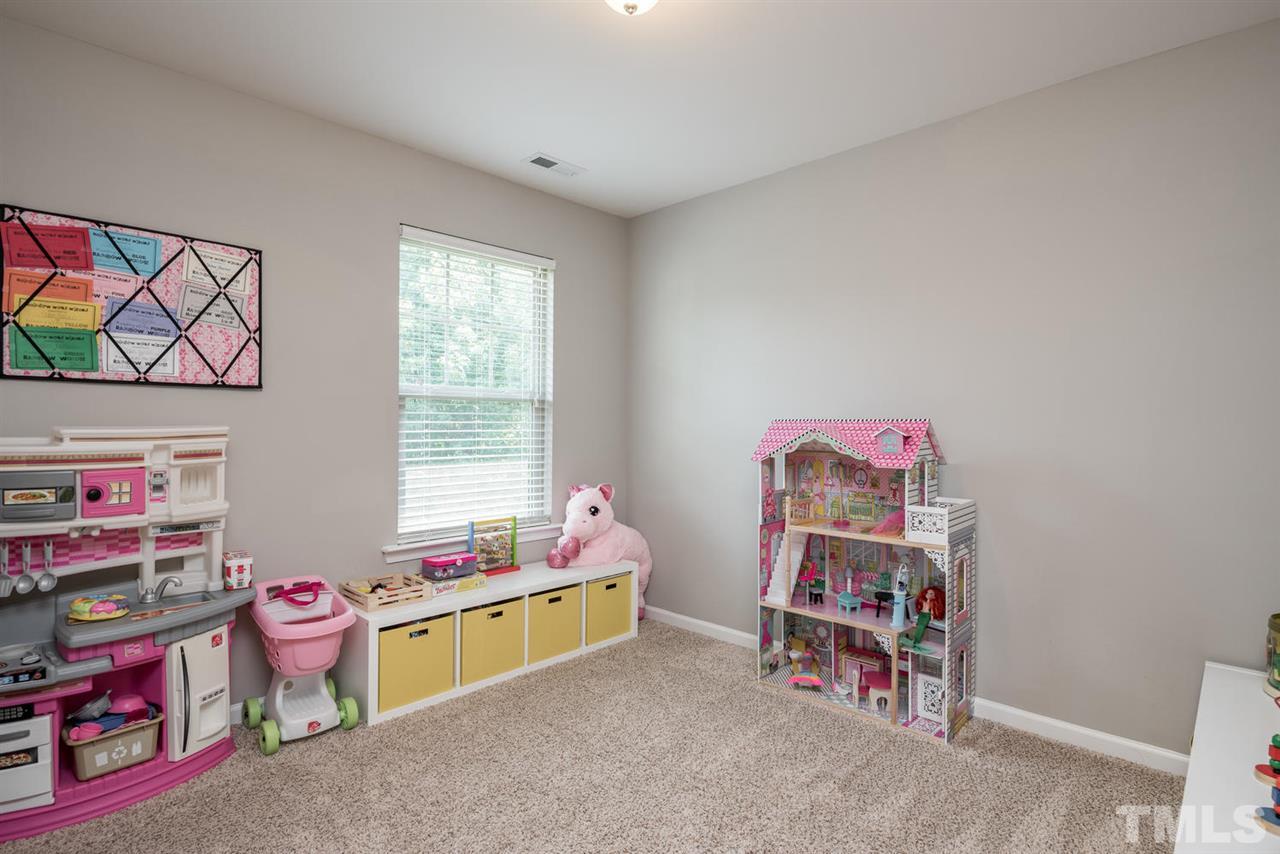 107 Holyoke Court Raleigh, NC 27603 - Photo 12 of 25 4th bedroom, a bonus room, or play room - you decide. This room has a closet.