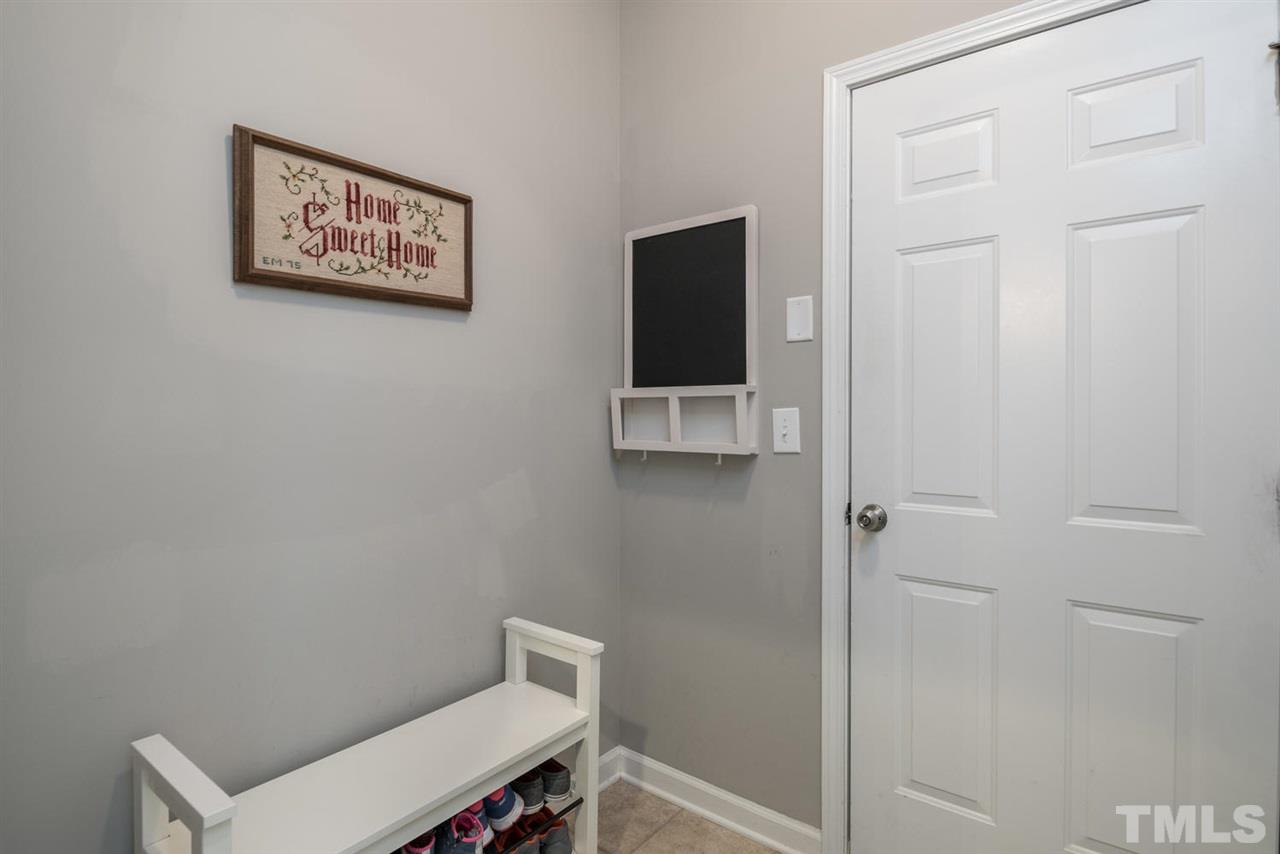 107 Holyoke Court Raleigh, NC 27603 - Photo 16 of 25 Keep your home clutter free and organized. Come in from the 2 car garage and drop your things here.