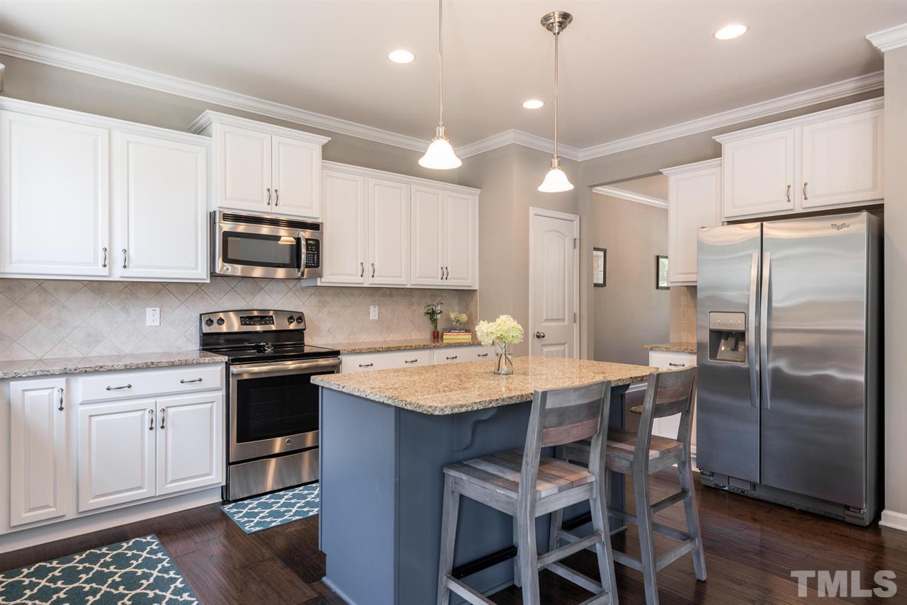 107 Holyoke Court Raleigh, NC 27603 - Photo 7 of 25 Plenty of counter space. Granite and stainless steel appliances.