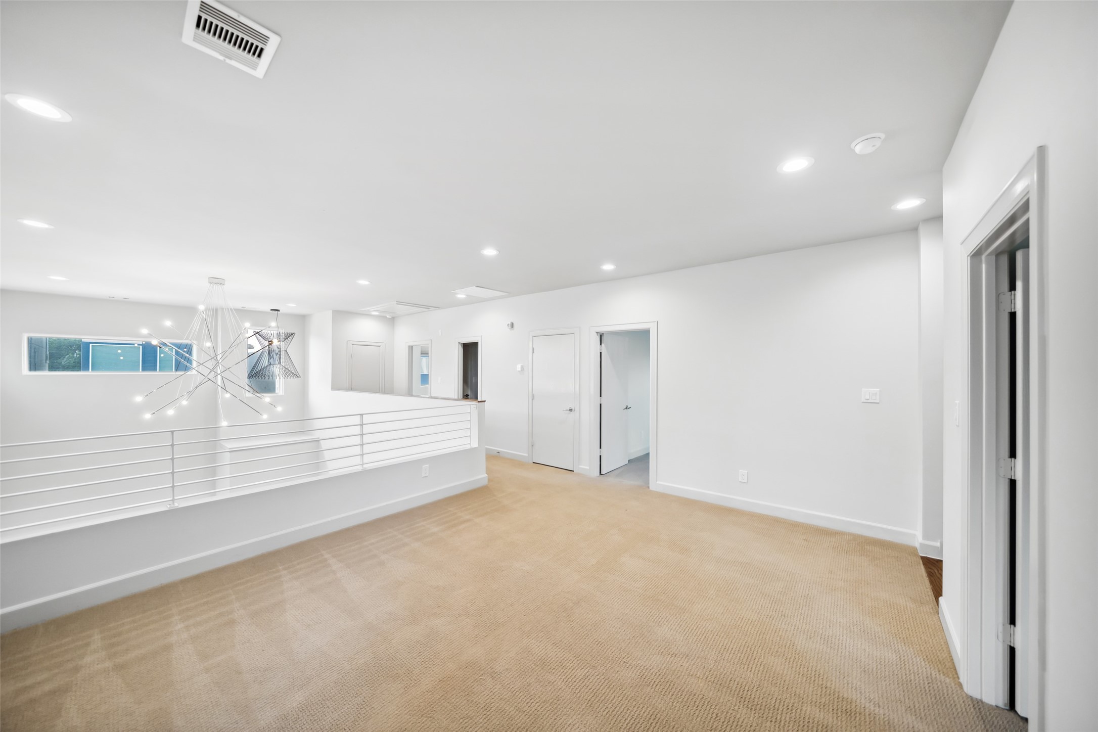 6809 Troya Lane Houston, TX 77092 - Photo 28 of 49 Versatile upstairs bonus area that is ideal as a family room, playroom, or home office. Overlooks the main living area below and is filled with natural light.