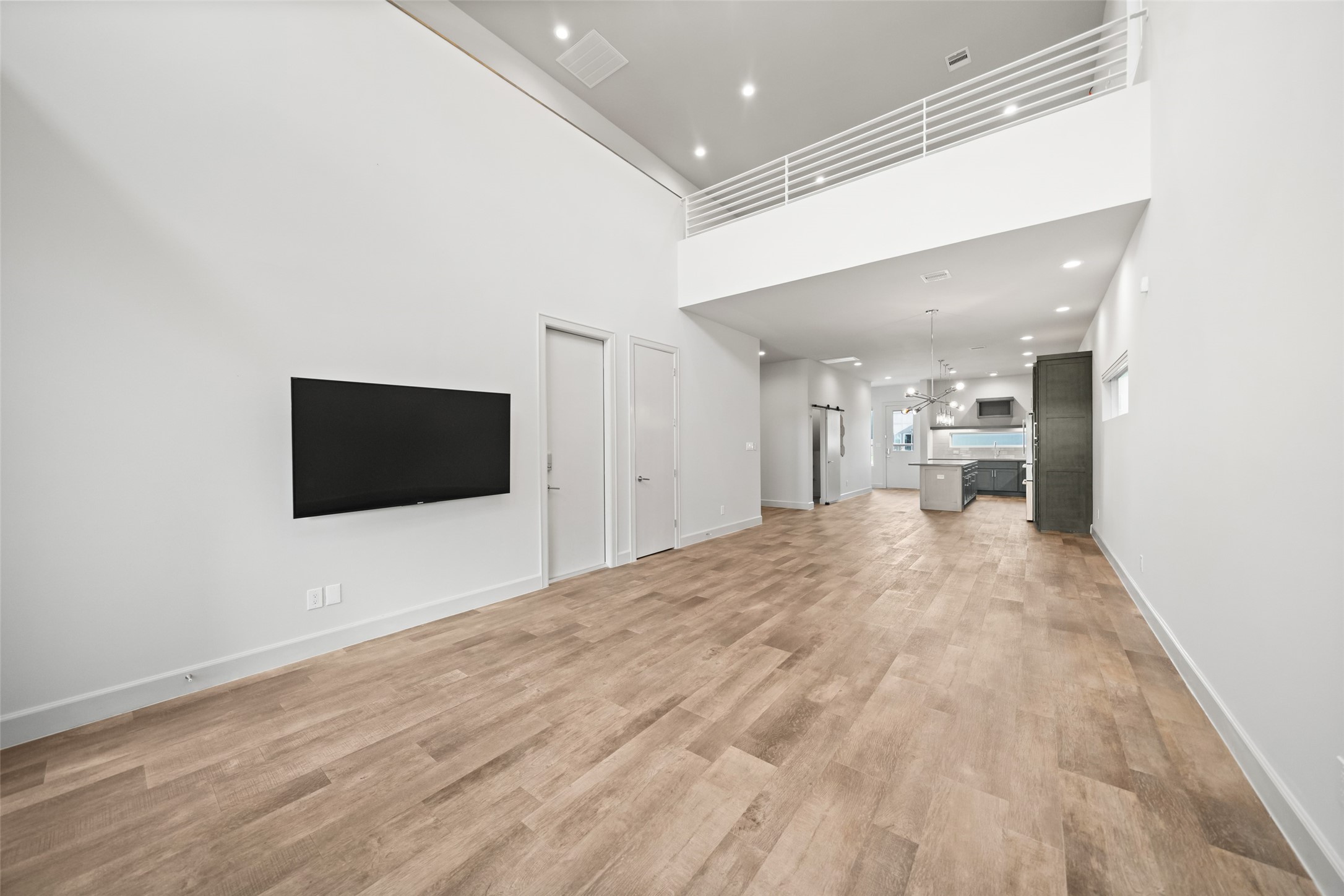 6809 Troya Lane Houston, TX 77092 - Photo 4 of 49 From the moment you walk in, this home delivers the wow factor and includes wood floors throughout the first floor and a bright, open-concept living space perfect for everyday living and entertaining.