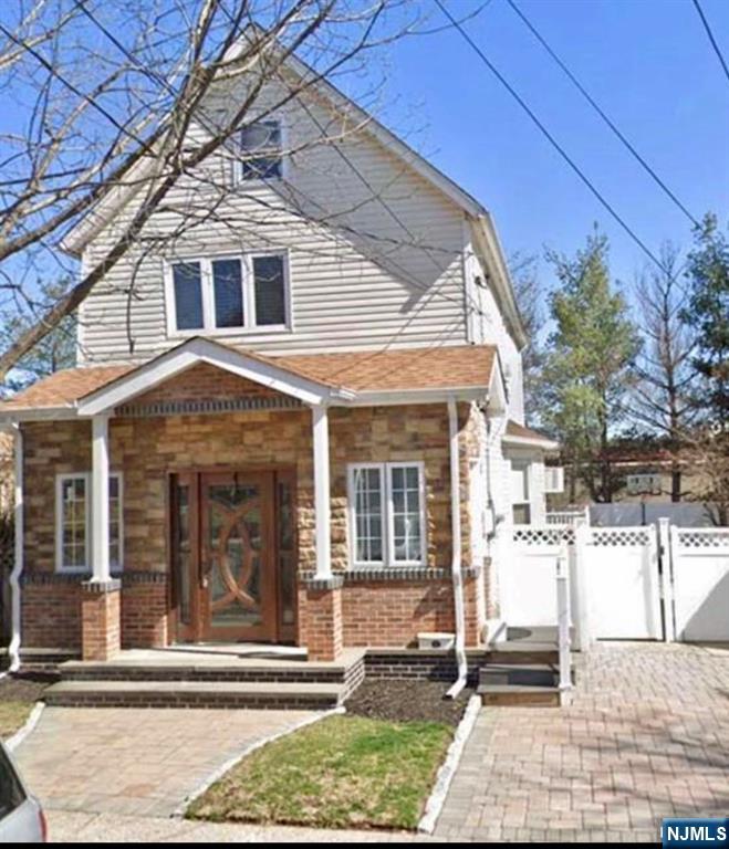 61 Hille Place, Unit 2 Ridgefield Park, NJ 07660 - Photo 1 of 19 a view of a brick house with large windows