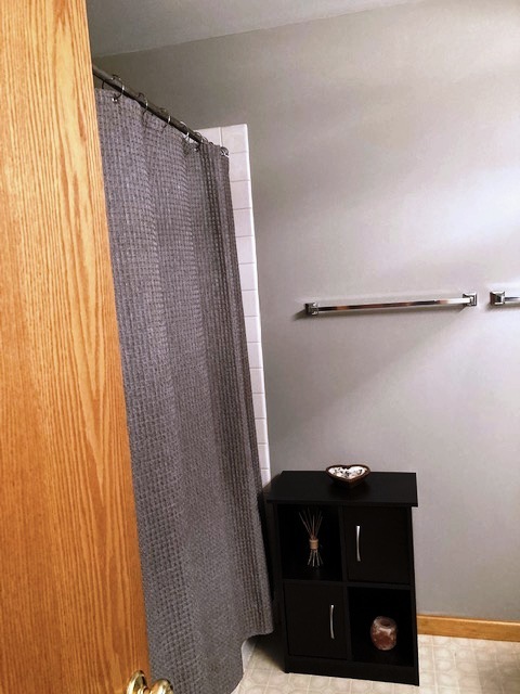 1945 Matthew Court, Unit D Elgin, IL 60123 - Photo 11 of 22 a view of a door and a cabinet in a room