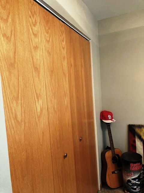 1945 Matthew Court, Unit D Elgin, IL 60123 - Photo 13 of 22 a room with a mirror and a table