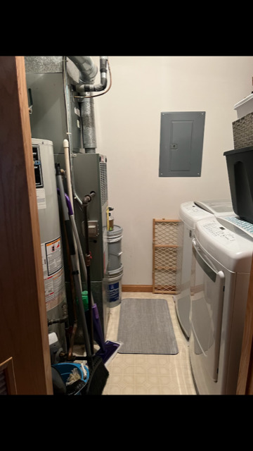 1945 Matthew Court, Unit D Elgin, IL 60123 - Photo 15 of 22 a living room with furniture and a flat screen tv