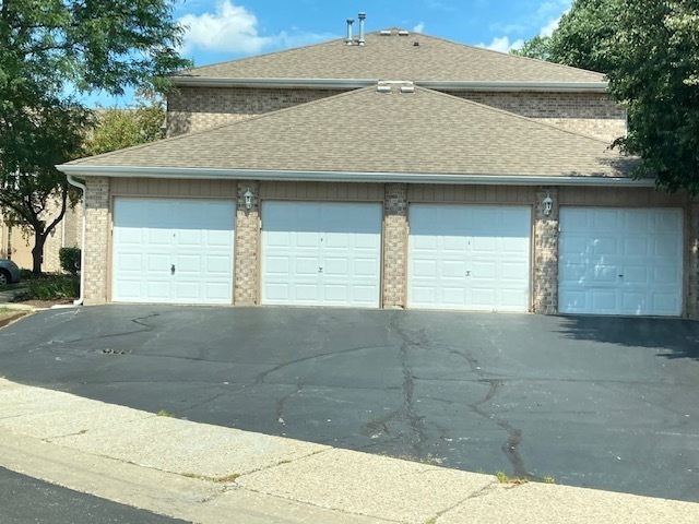 1945 Matthew Court, Unit D Elgin, IL 60123 - Photo 21 of 22 a front view of a house