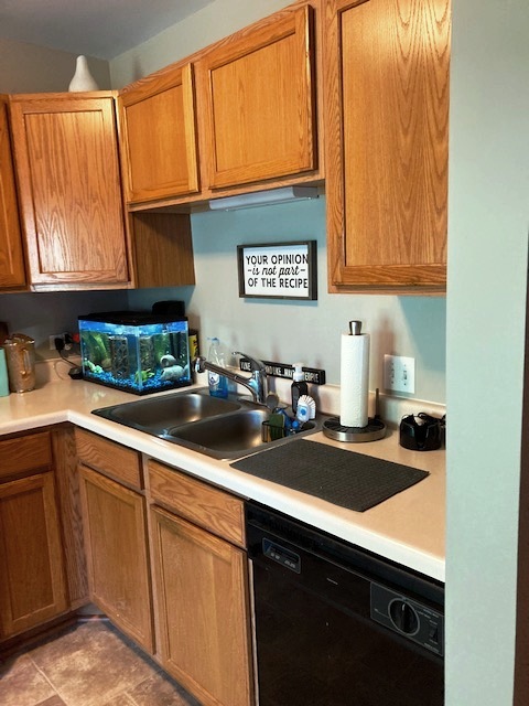 1945 Matthew Court, Unit D Elgin, IL 60123 - Photo 6 of 22 a kitchen with stainless steel appliances granite countertop a sink stove and cabinets