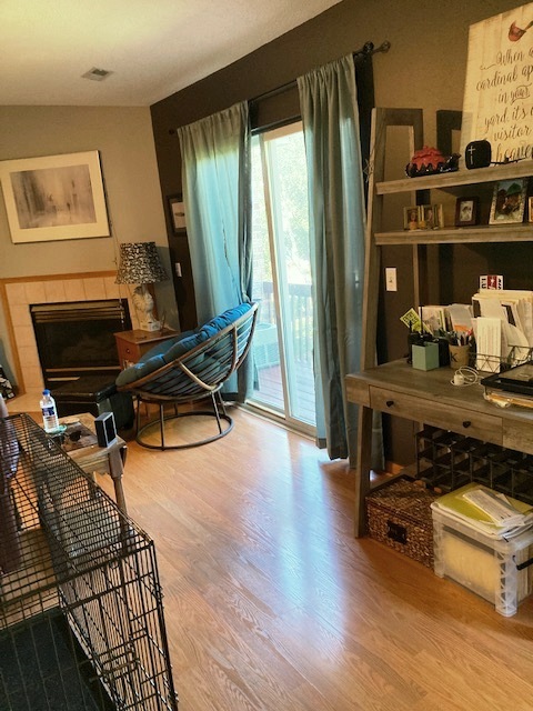 1945 Matthew Court, Unit D Elgin, IL 60123 - Photo 8 of 22 a room with wooden floor and furniture