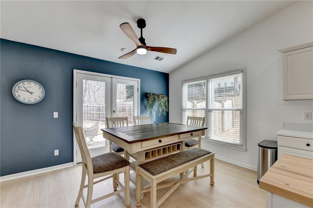 6435 Dressage Crossing Cumming, GA 30040 - Photo 14 of 35 a room with chandelier furniture and windows