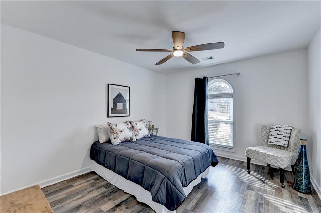6435 Dressage Crossing Cumming, GA 30040 - Photo 22 of 35 a bedroom with a bed and a window