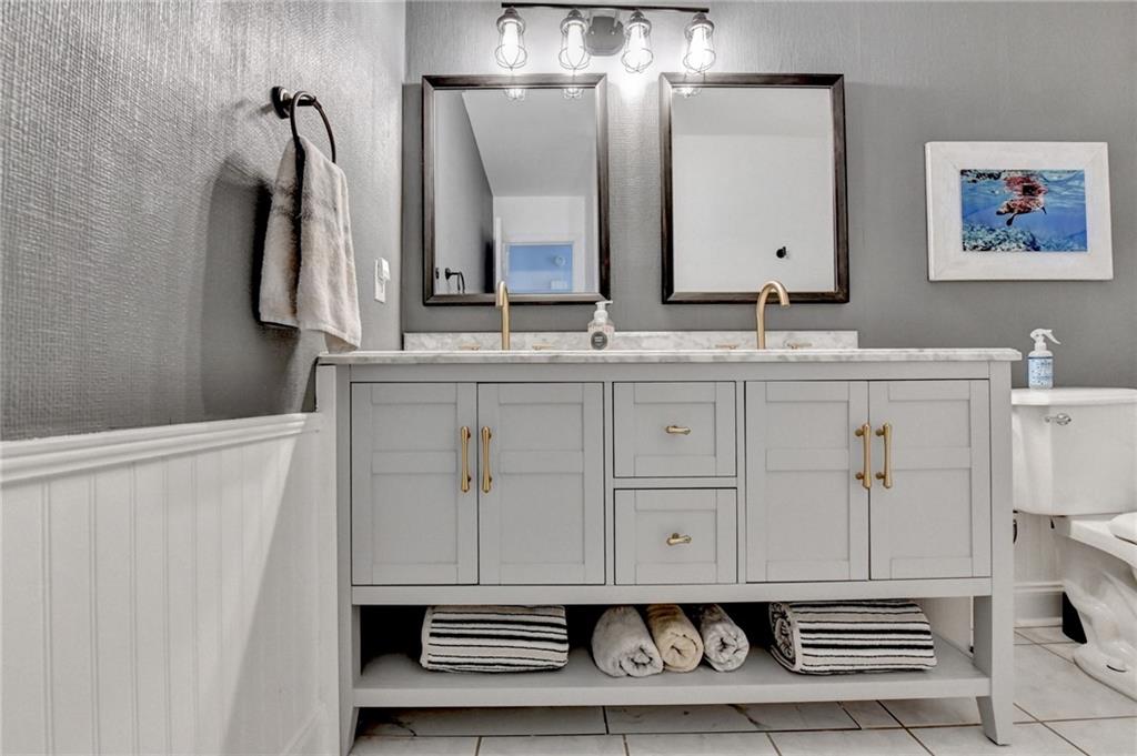 6435 Dressage Crossing Cumming, GA 30040 - Photo 24 of 35 a bathroom with a sink and a mirror