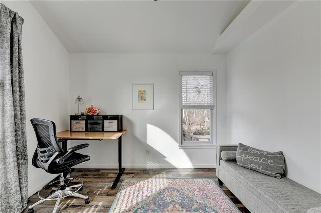 6435 Dressage Crossing Cumming, GA 30040 - Photo 27 of 35 a living room with furniture and wooden floor