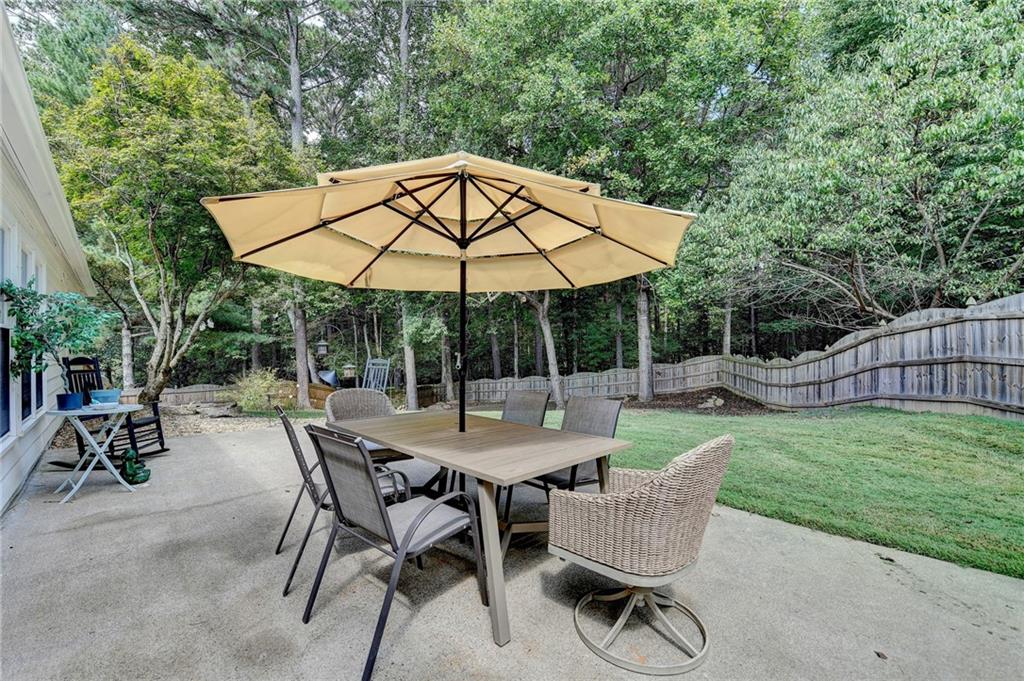 6435 Dressage Crossing Cumming, GA 30040 - Photo 29 of 35 a view of backyard of house with seating space