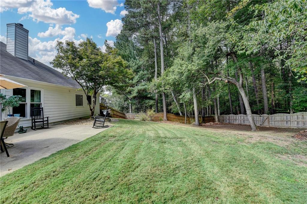 6435 Dressage Crossing Cumming, GA 30040 - Photo 30 of 35 a view of a backyard with a sitting area