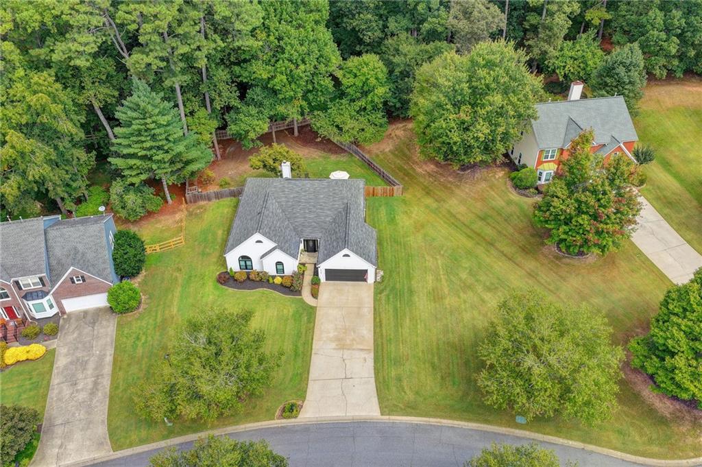 6435 Dressage Crossing Cumming, GA 30040 - Photo 31 of 35 an aerial view of a house with a yard basket ball court and outdoor seating
