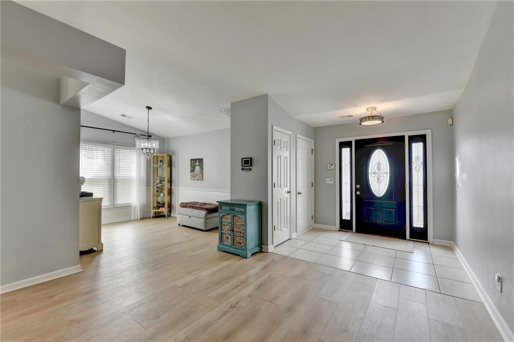 6435 Dressage Crossing Cumming, GA 30040 - Photo 4 of 35 a spacious bedroom with a bed and a large window