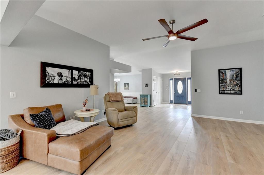 6435 Dressage Crossing Cumming, GA 30040 - Photo 7 of 35 a living room with furniture and a wooden floor