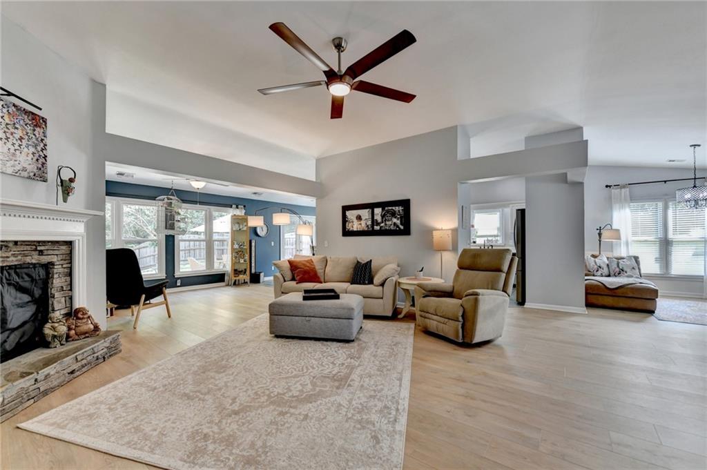 6435 Dressage Crossing Cumming, GA 30040 - Photo 8 of 35 a living room with furniture and a fireplace