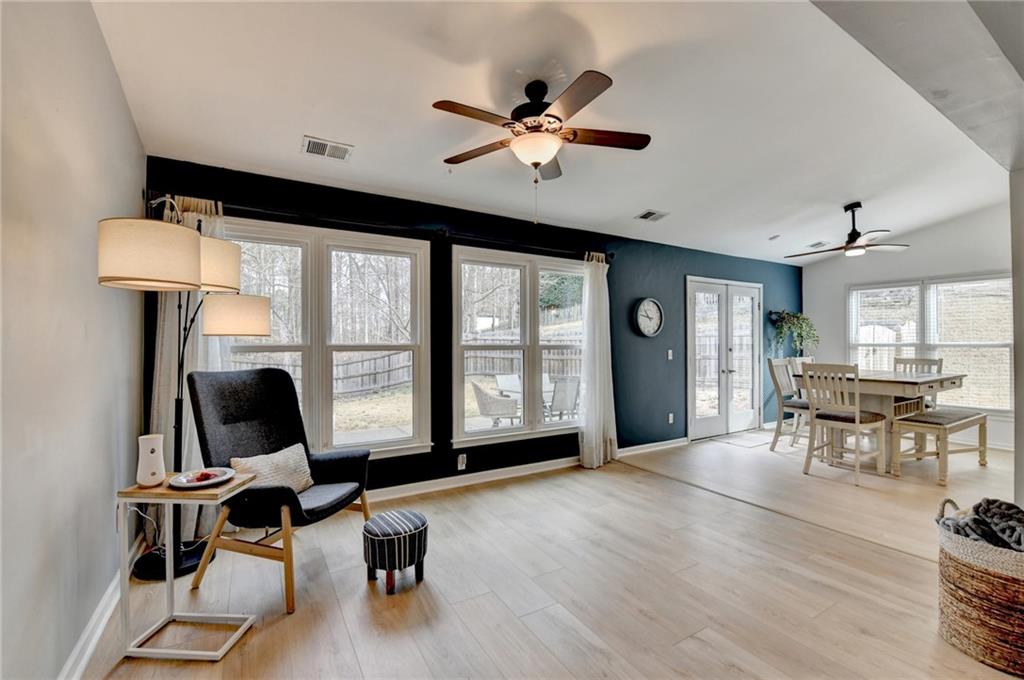 6435 Dressage Crossing Cumming, GA 30040 - Photo 9 of 35 a living room with furniture window and wooden floor