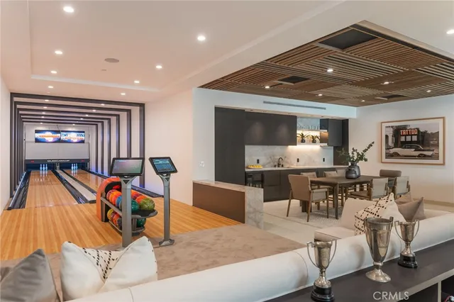 a kitchen with stainless steel appliances kitchen island granite countertop a sink and cabinets