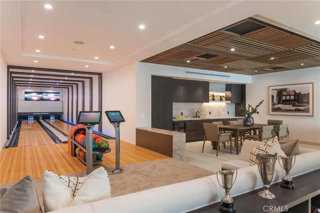 24255 Bridle Trail Road Hidden Hills, CA 91302 - Photo 17 of 52 a living room with furniture and a gym