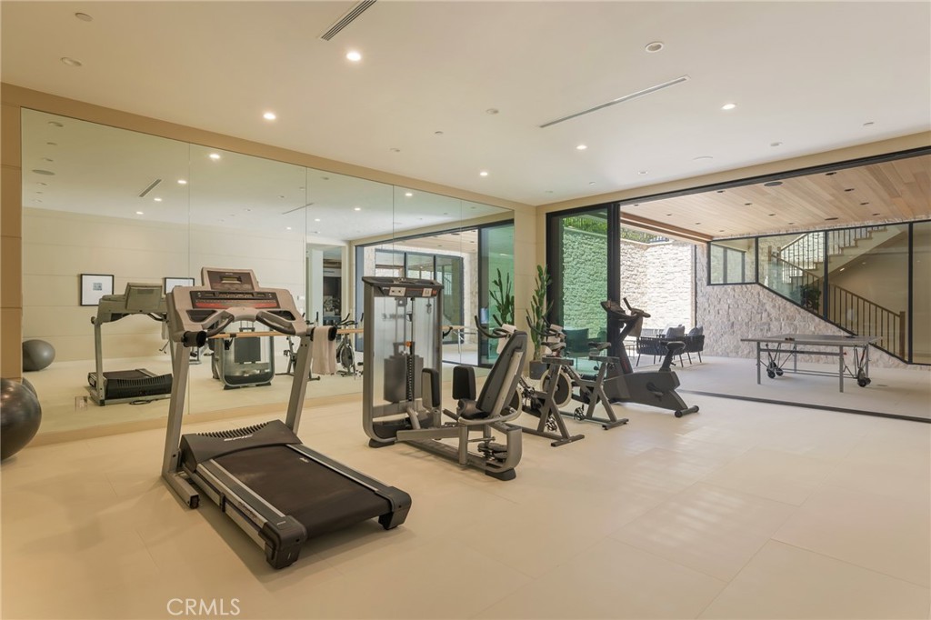 24255 Bridle Trail Road Hidden Hills, CA 91302 - Photo 19 of 52 a view of a room with gym equipment