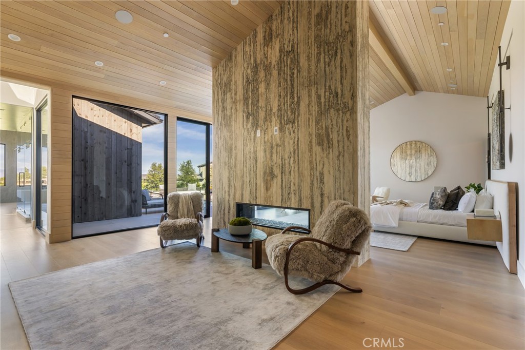 24255 Bridle Trail Road Hidden Hills, CA 91302 - Photo 23 of 52 a living room with furniture and a large window