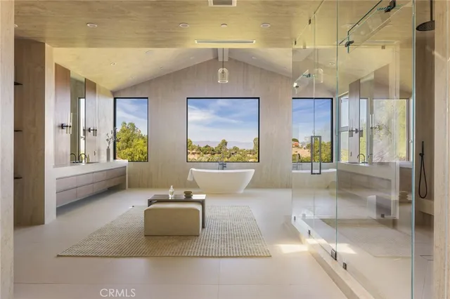 a bathroom with a glass shower door