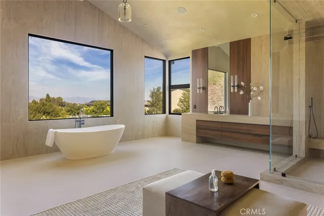 a bathroom with a bathtub and window