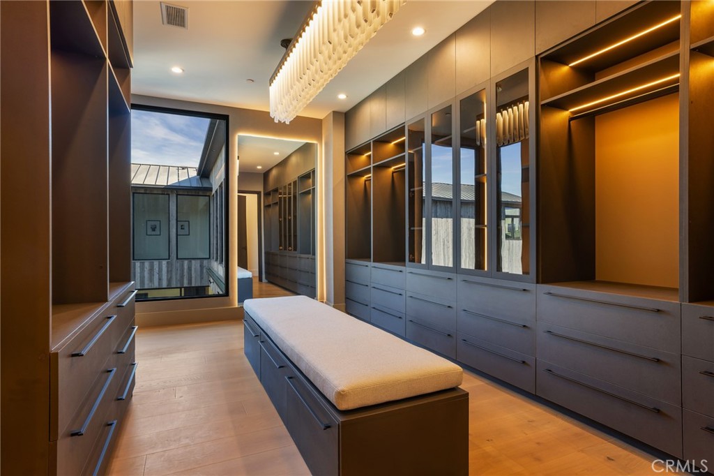 24255 Bridle Trail Road Hidden Hills, CA 91302 - Photo 32 of 52 a lobby with glass door and chandelier