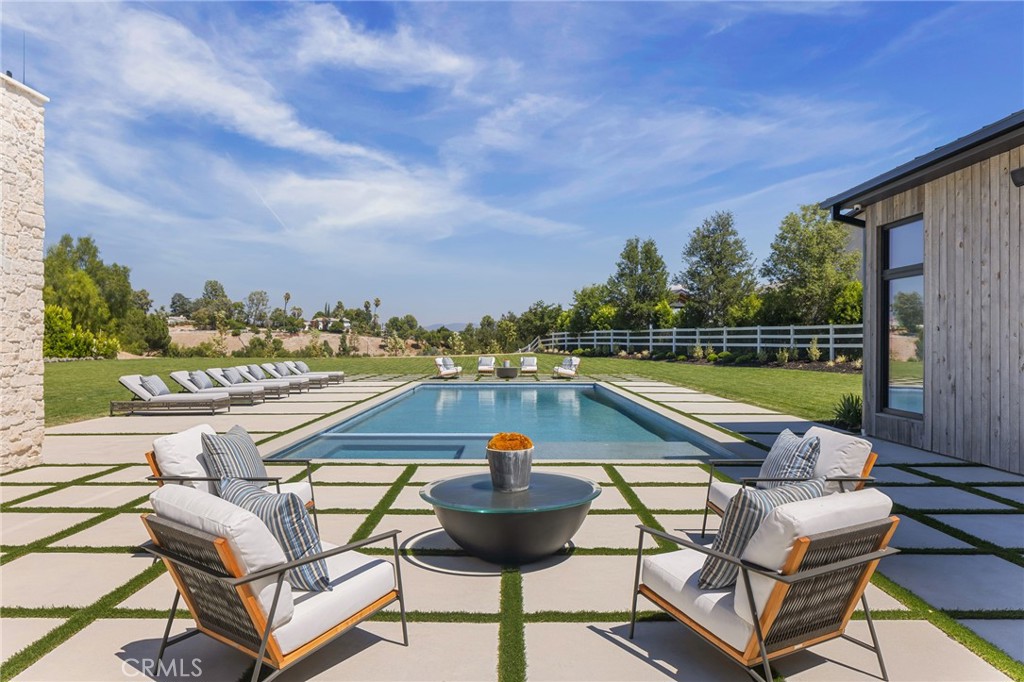24255 Bridle Trail Road Hidden Hills, CA 91302 - Photo 44 of 52 a view of swimming pool with outdoor seating