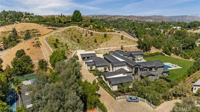 a view of a patio with table and chairs with wooden floor
