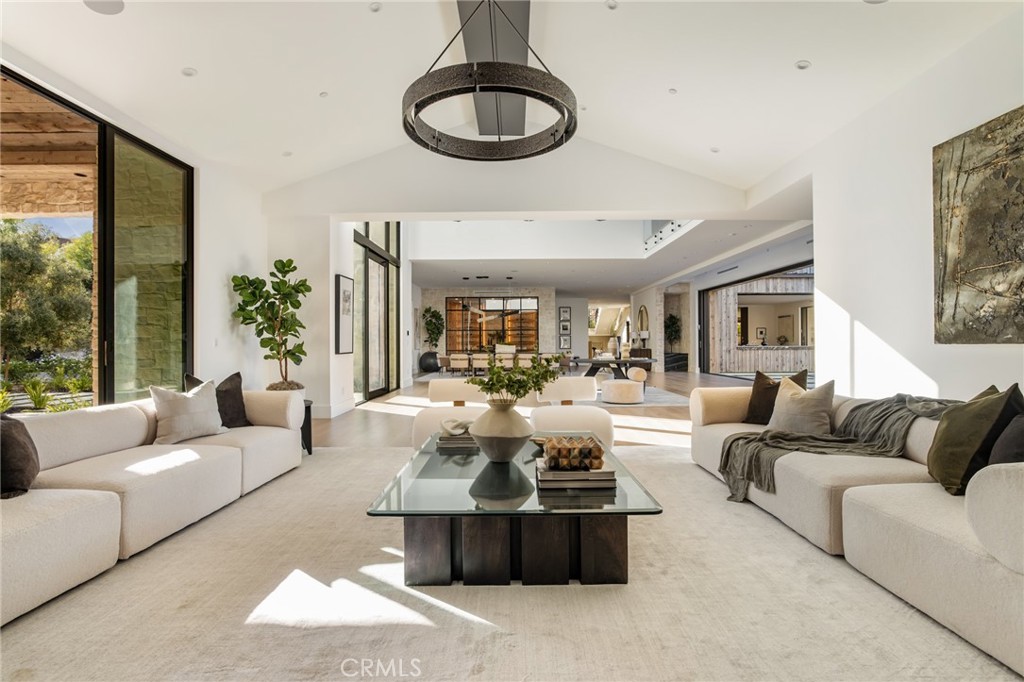 24255 Bridle Trail Road Hidden Hills, CA 91302 - Photo 5 of 52 a living room with furniture and a floor to ceiling window