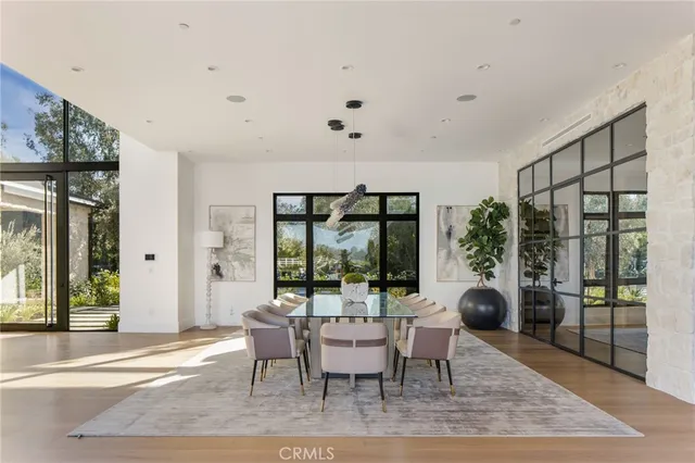 a view of a dining room with furniture and a window