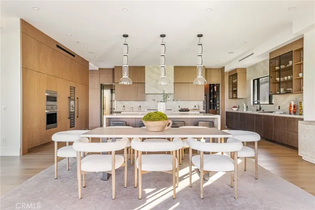 a kitchen with counter top space a sink and appliances