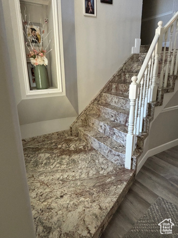 1874 South Main Street Orem, UT 84058 - Photo 7 of 15 Staircase featuring wood finished floors and baseboards