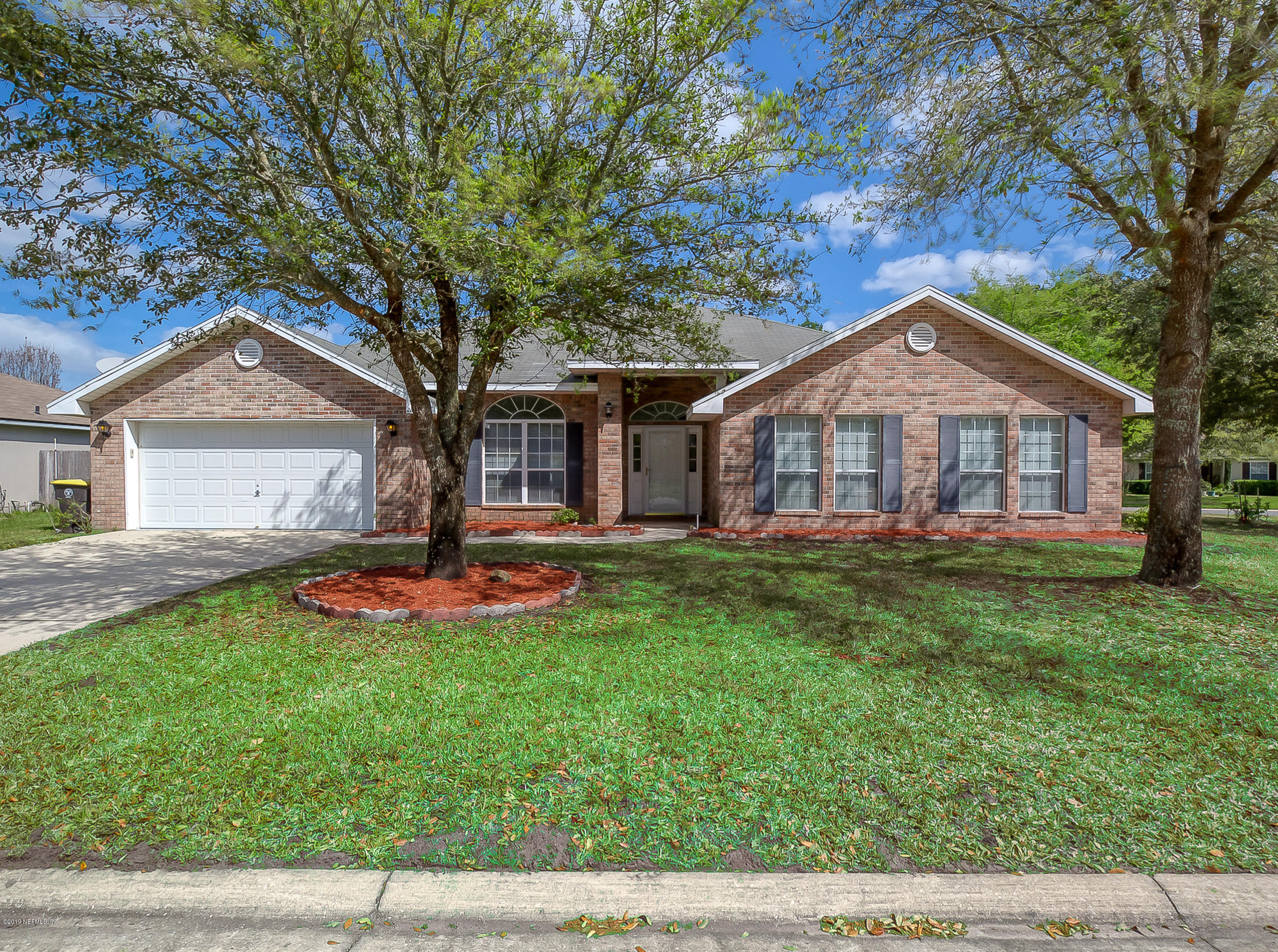 2633 Springwillow Drive Jacksonville, FL 32221 - Photo 1 of 33 a front view of a house with a yard