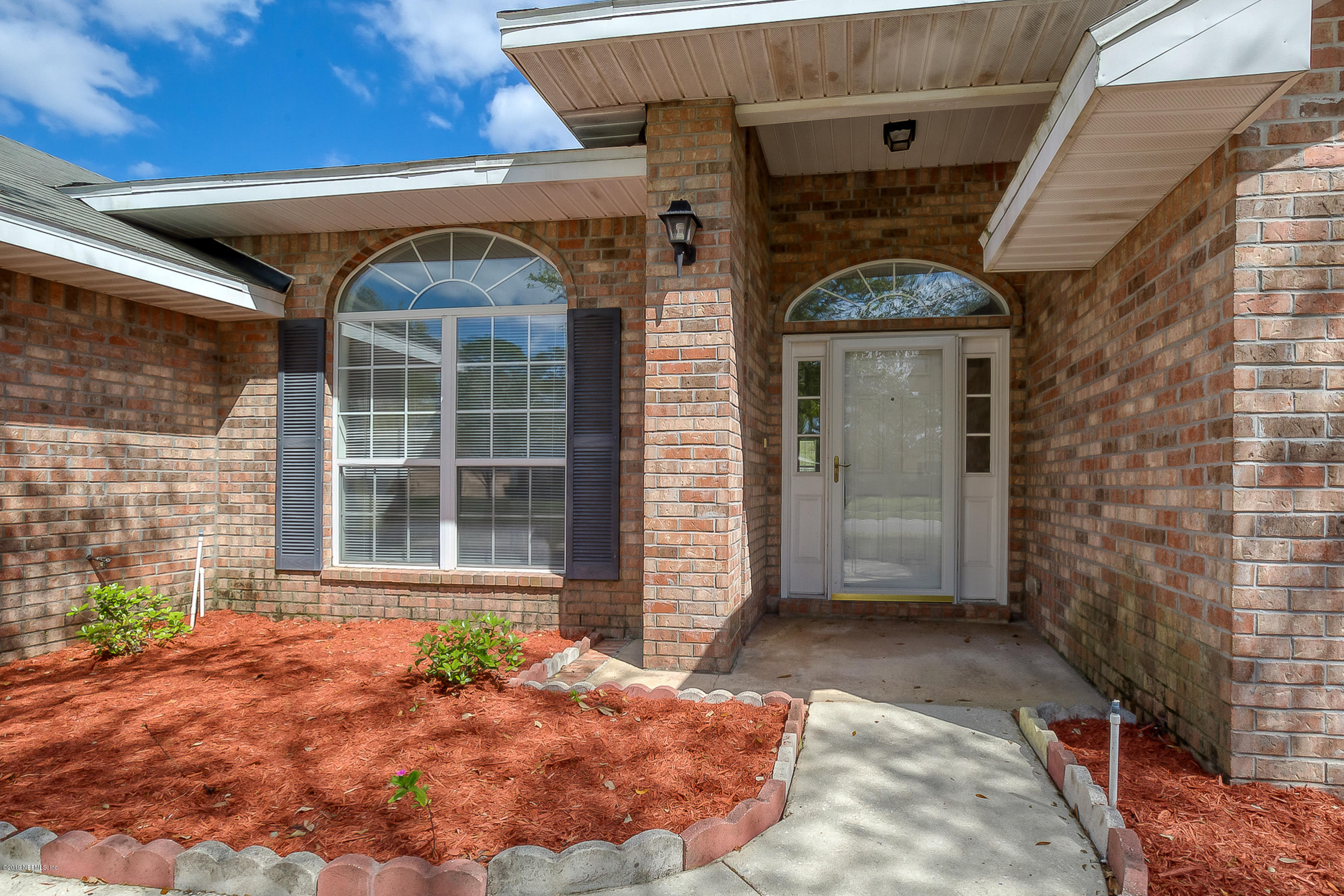 2633 Springwillow Drive Jacksonville, FL 32221 - Photo 2 of 33 a front view of a house with a yard