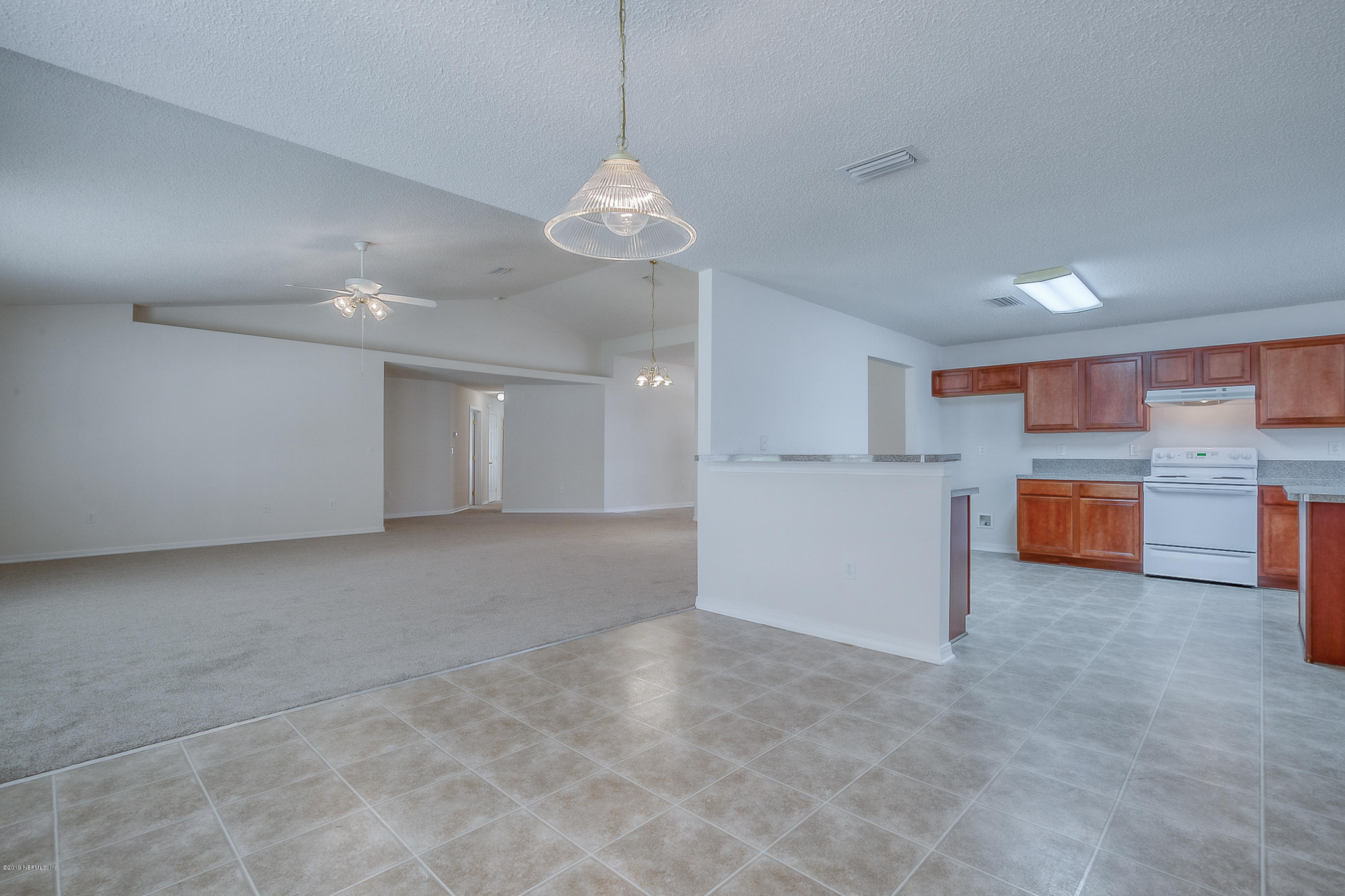 2633 Springwillow Drive Jacksonville, FL 32221 - Photo 8 of 33 a view of a kitchen with a stove cabinets and a kitchen