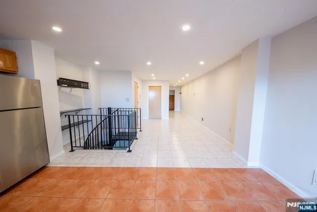 a view of a hall with wooden floor