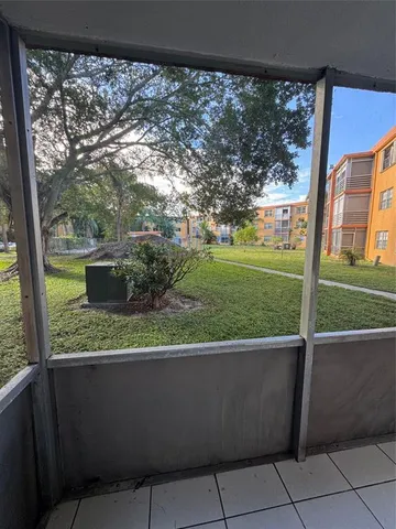 a view of a porch with a yard