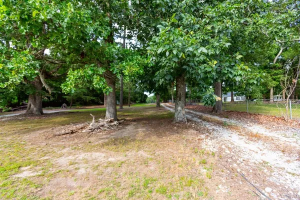 a view of a yard with swimming pool