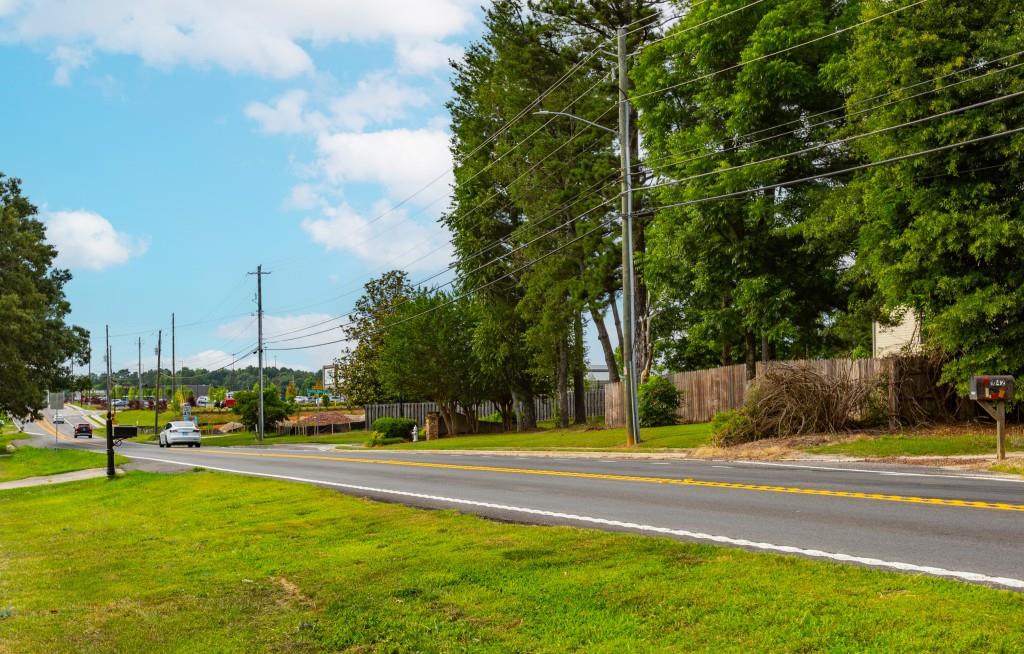 1042 Harbins Road Dacula, GA 30019 - Photo 15 of 33 a view of swimming pool with lawn chairs and plants